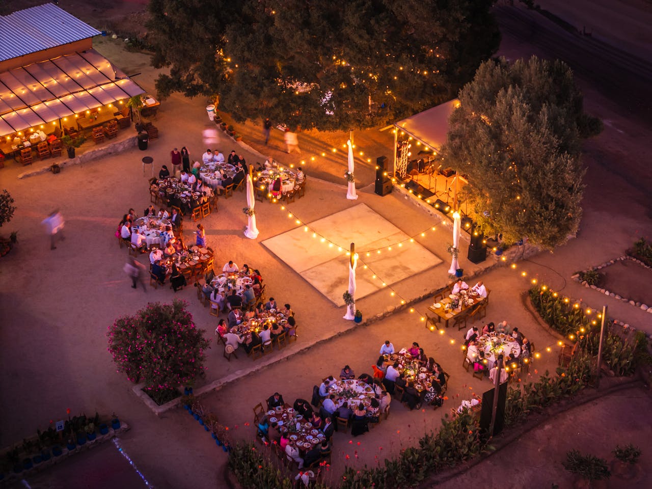 Outdoor social event with warm lights